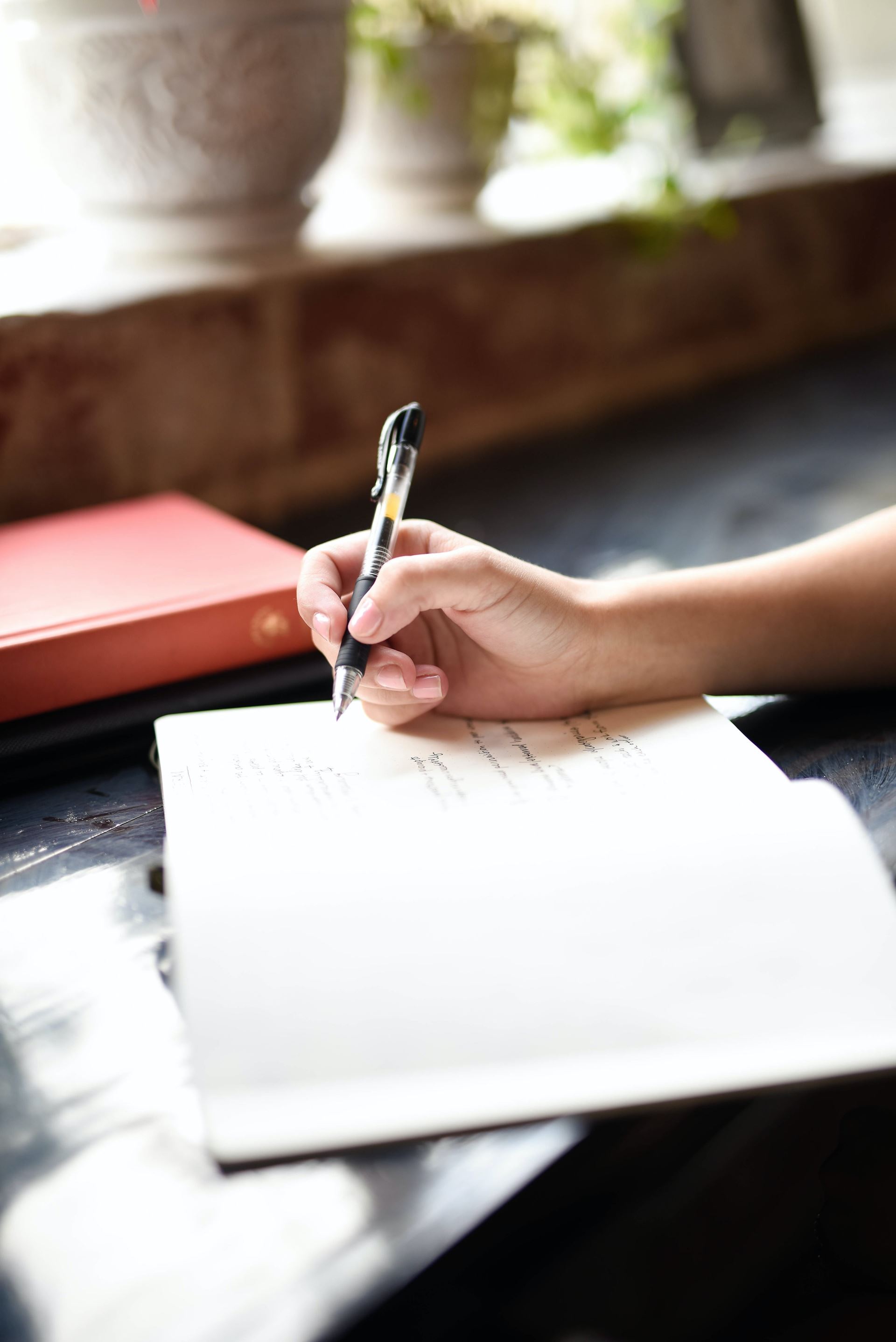 person writing on paper